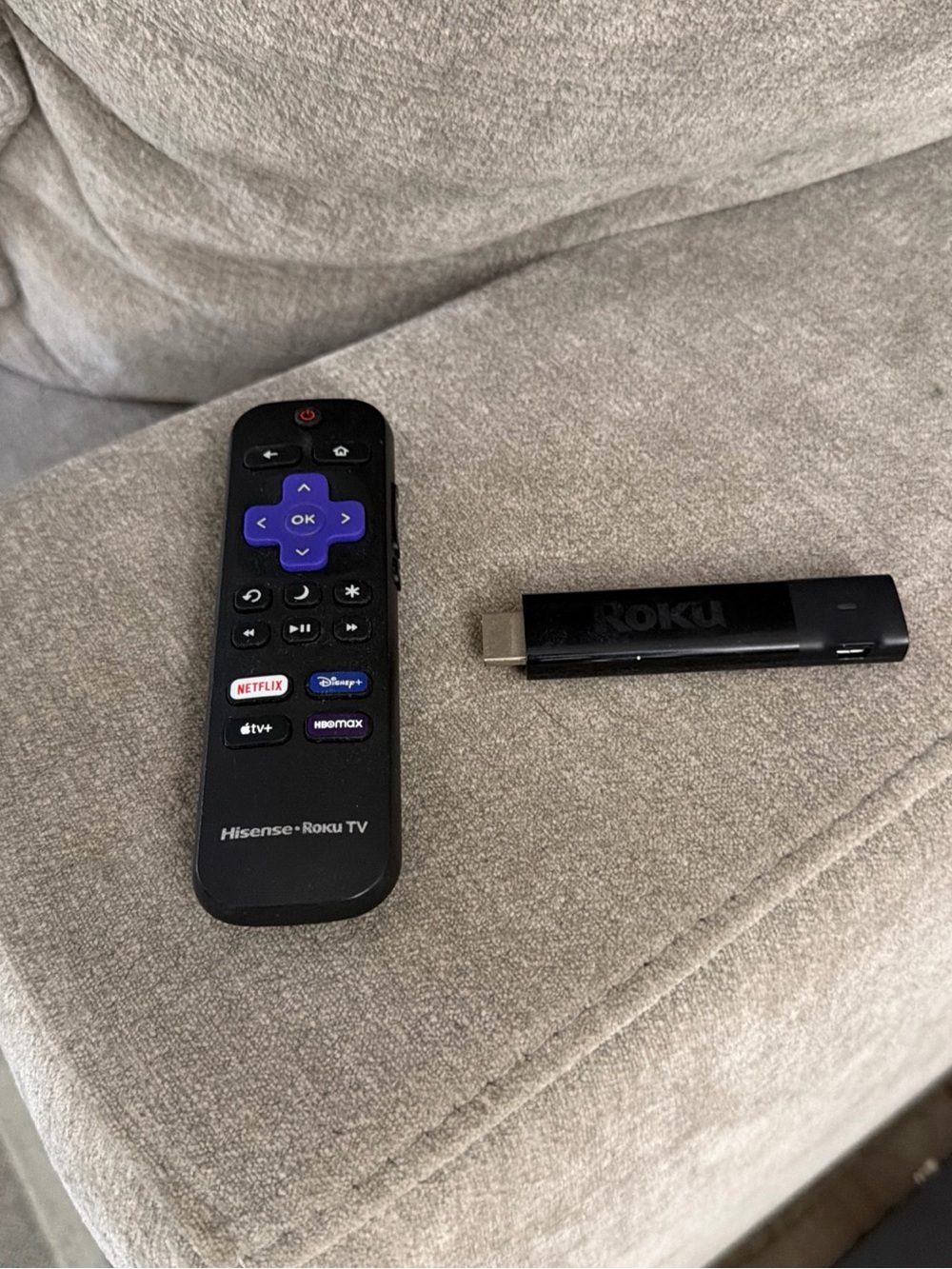 Hisense Black Remote with Purple Navigation Pad and Black Roku Streaming Stick